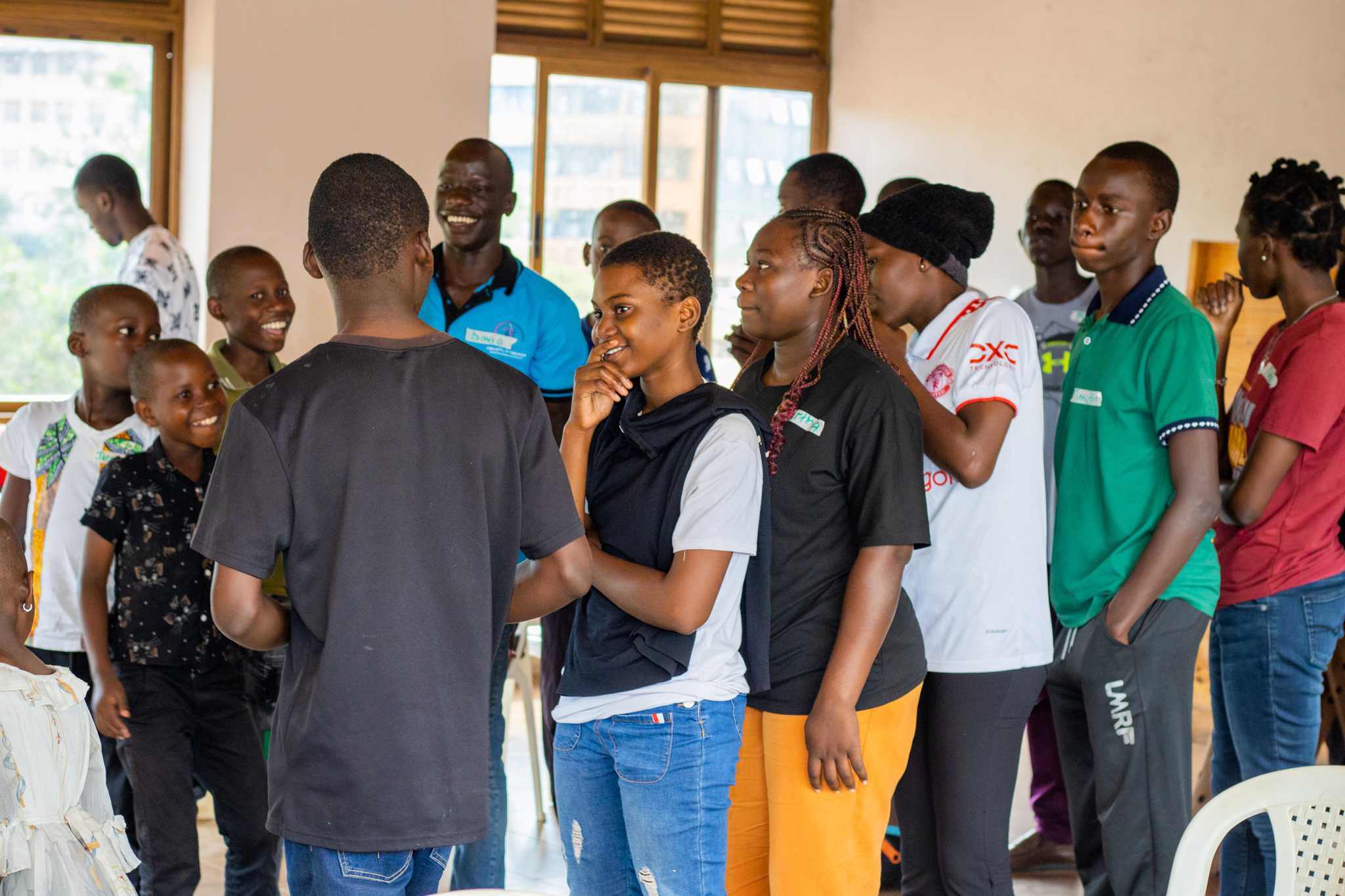Young people and adults participating in an indoor group activity