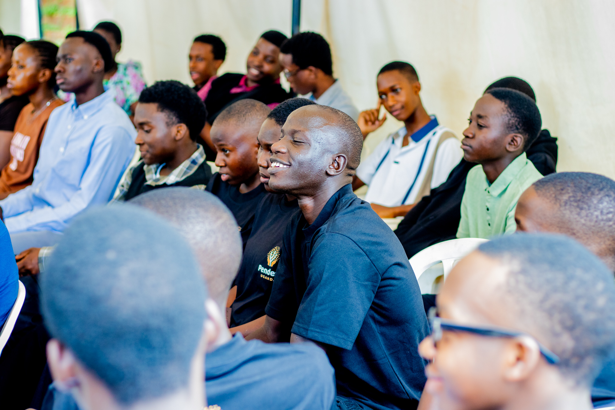 Participants listening during a community gathering